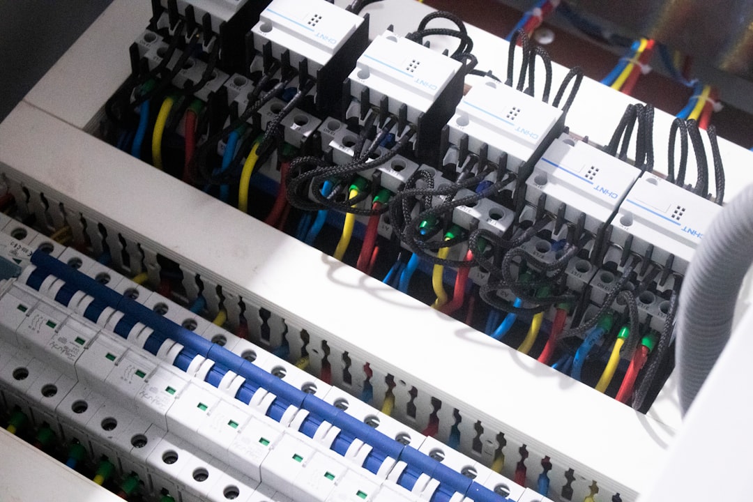 Modern electrical panel with glowing circuit breakers and smart home devices