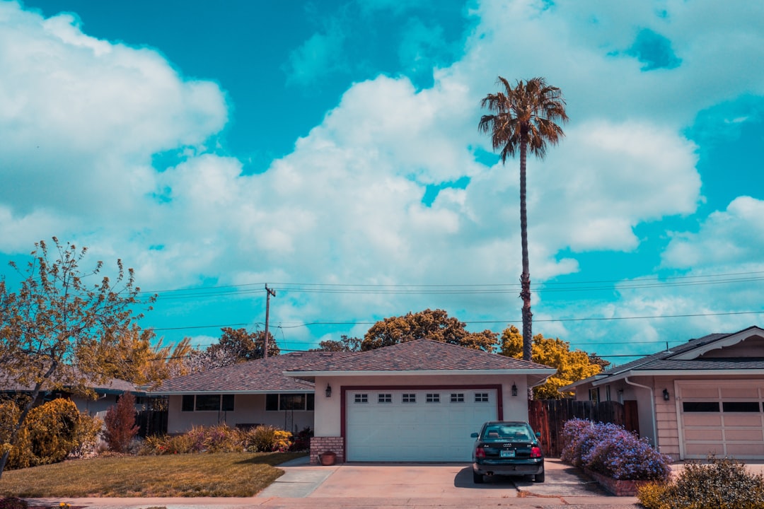 Electric vehicle charging at a modern home in Southern California at sunset