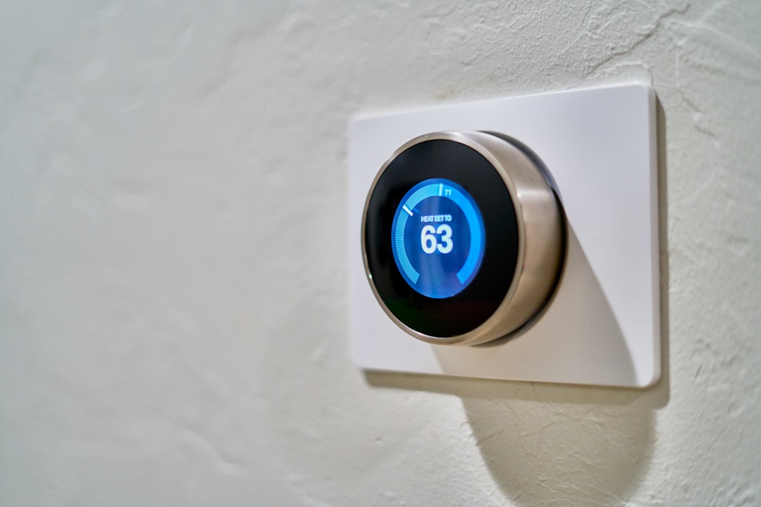 A smart electrical panel with a tablet displaying real-time energy usage data in a modern home